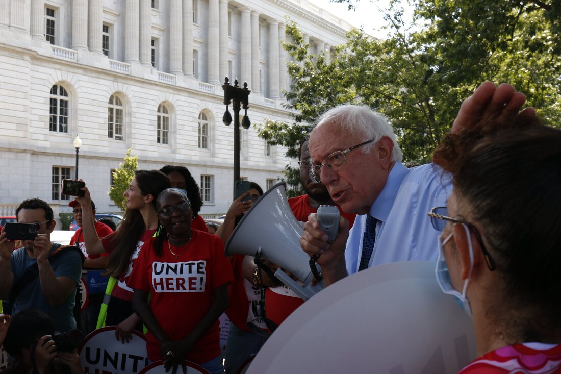 Sen. Bernie Sanders, I-Vermont, speaks outside of the Senate office buildings at the US Capitol while a union is striking outside in Summer 2022. 