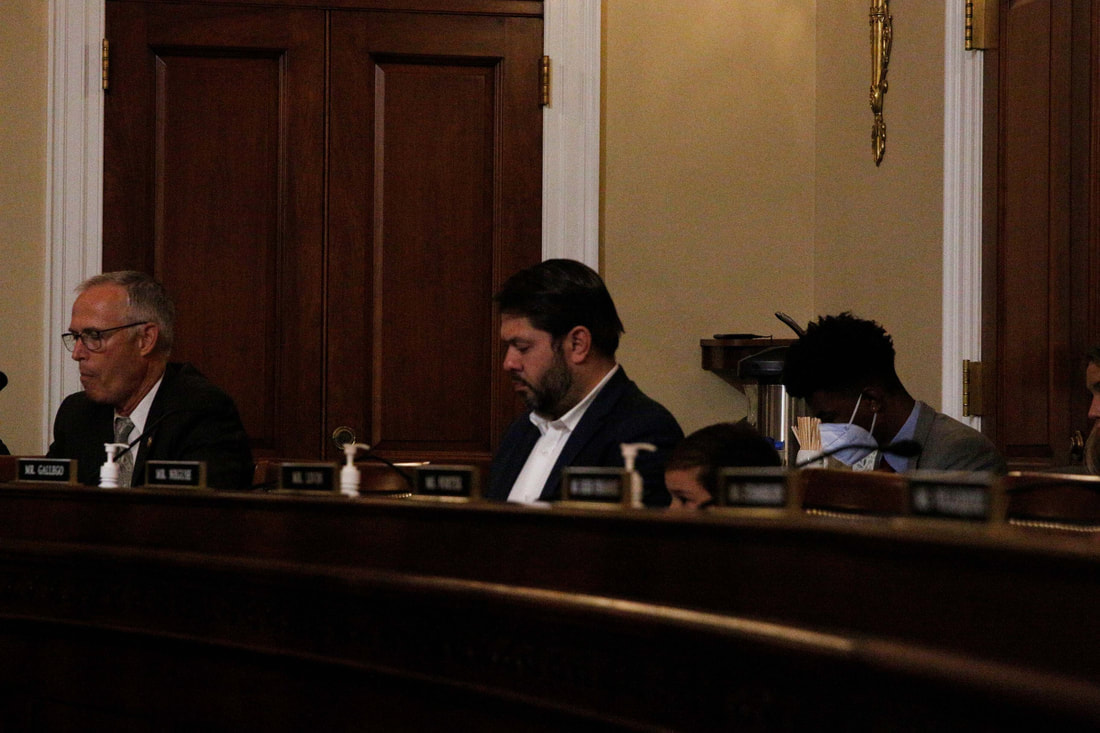 Rep. Ruben Gallego, D-Phoenix, sits with his son during a committee meeting in the US House of Representatives in the summer of 2022. 